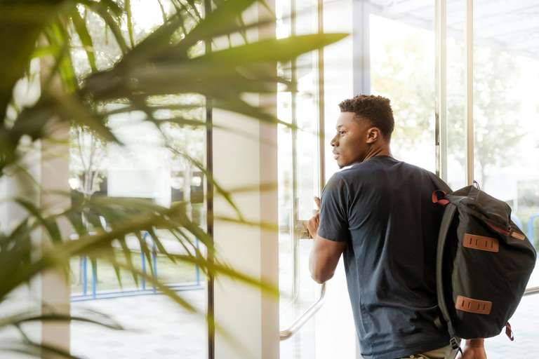 A student carrying a schoolbag
